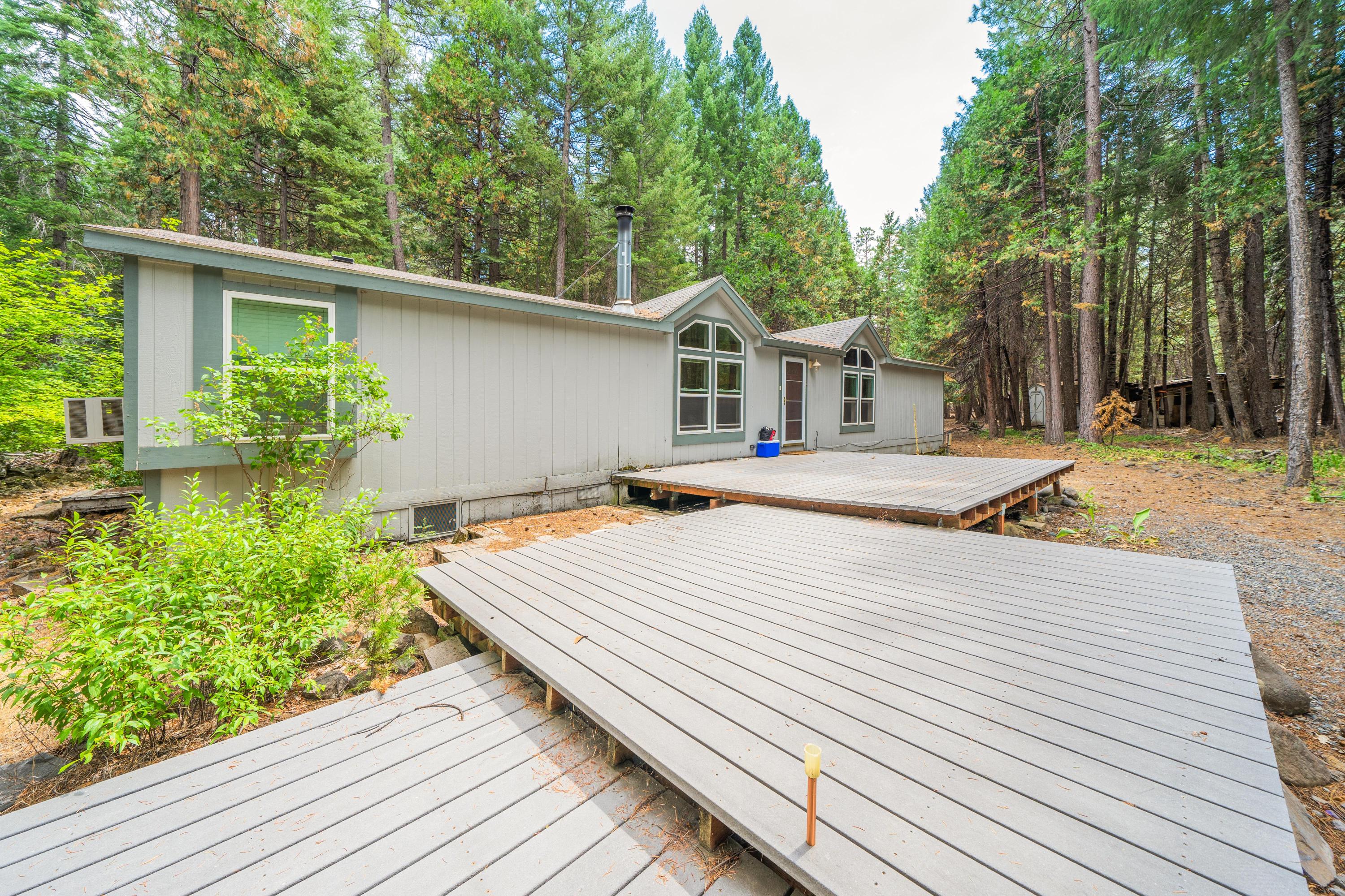 34739 Timber Ridge Road Shingletown, CA 96088 - Photo 3 of 26 a house with trees in the background
