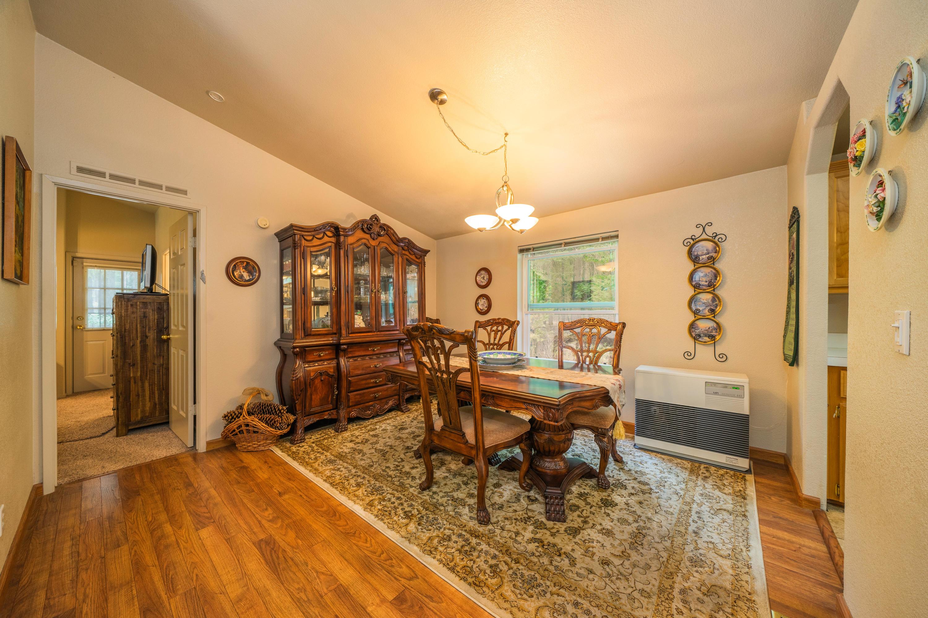 34739 Timber Ridge Road Shingletown, CA 96088 - Photo 10 of 26 a living room with furniture and wooden floor
