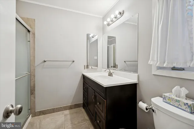 a kitchen with a sink and a refrigerator