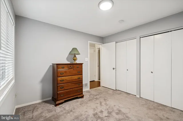 a view of room with closet and natural light