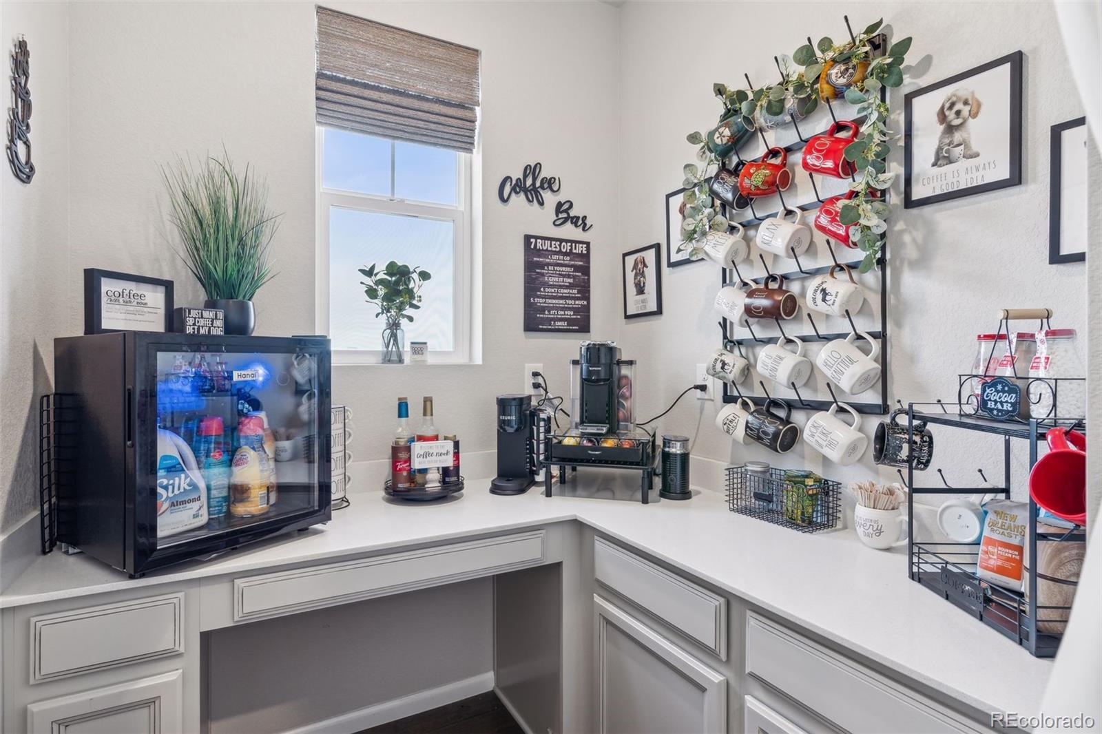 23913 East Minnow Circle Aurora, CO 80016 - Photo 24 of 49 a kitchen with lots of counter top space and wooden floor