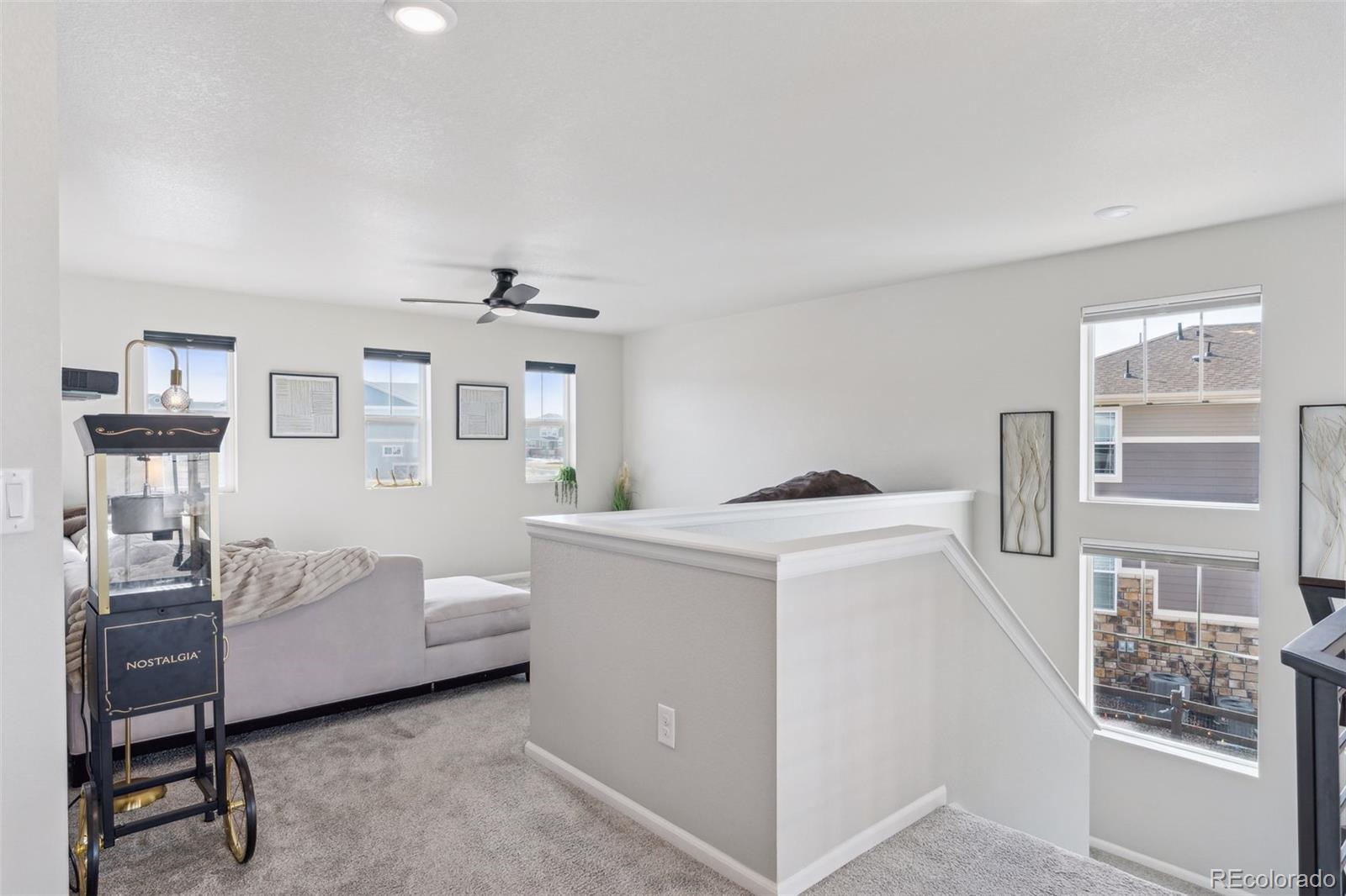 23913 East Minnow Circle Aurora, CO 80016 - Photo 26 of 49 a living room with furniture and a window