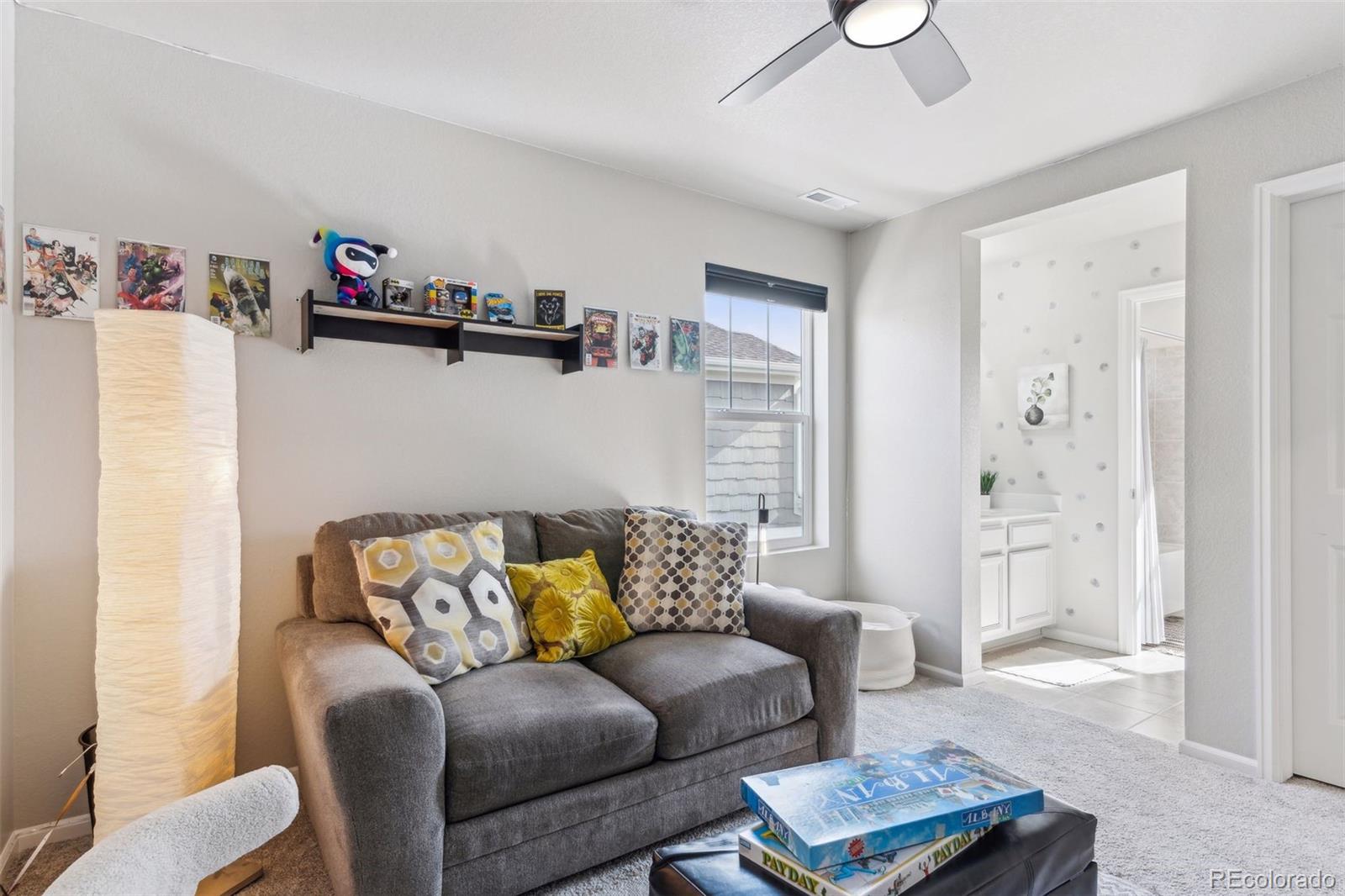 23913 East Minnow Circle Aurora, CO 80016 - Photo 29 of 49 a living room with furniture and a wooden floor