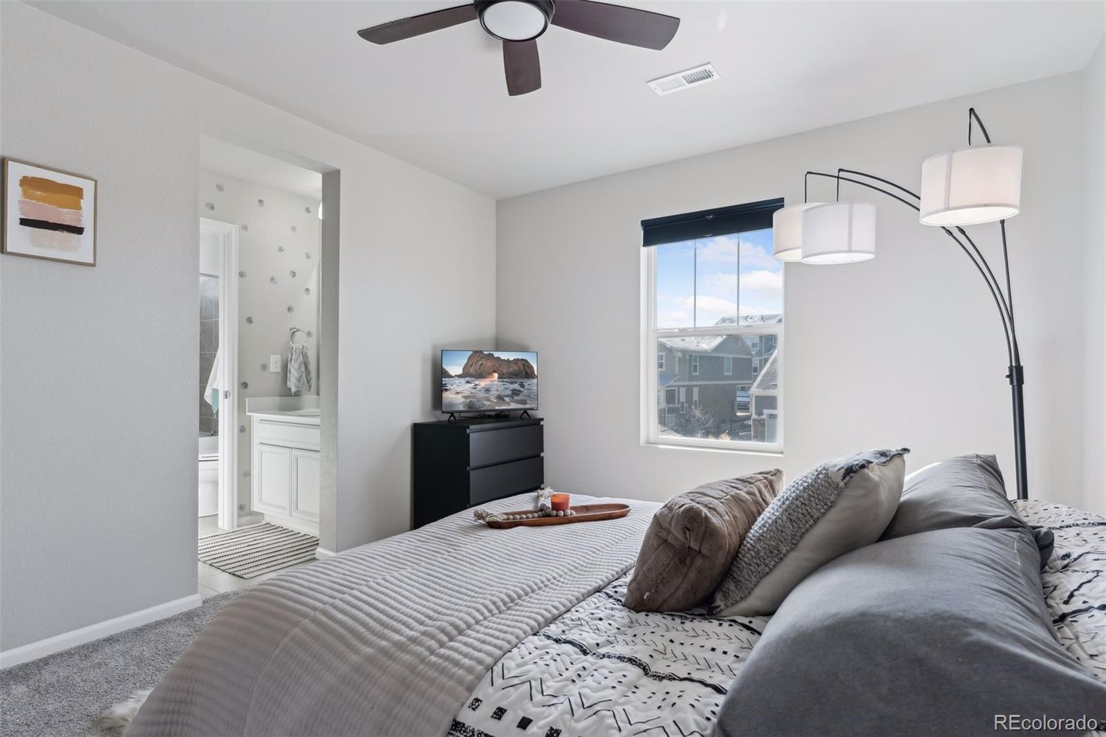 23913 East Minnow Circle Aurora, CO 80016 - Photo 32 of 49 a bedroom with a bed and wooden floor