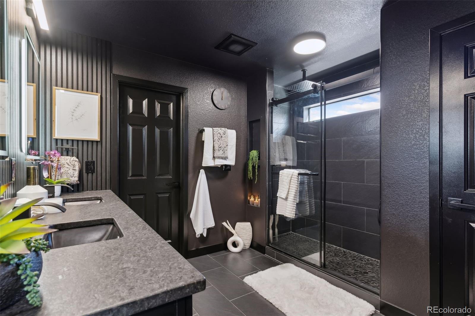 23913 East Minnow Circle Aurora, CO 80016 - Photo 37 of 49 a living room with furniture a window and a glass door shower