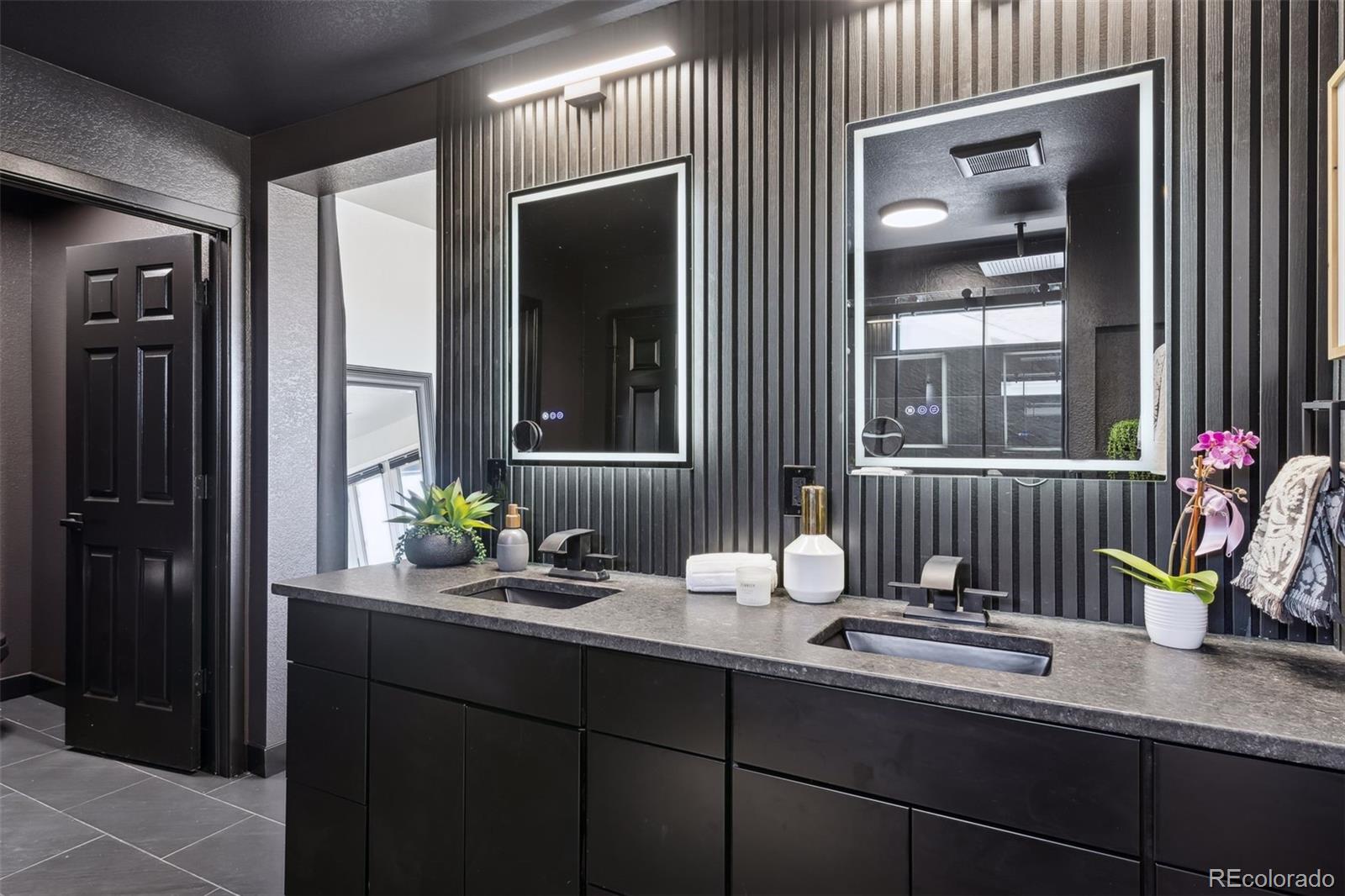23913 East Minnow Circle Aurora, CO 80016 - Photo 39 of 49 a bathroom with a sink and a mirror