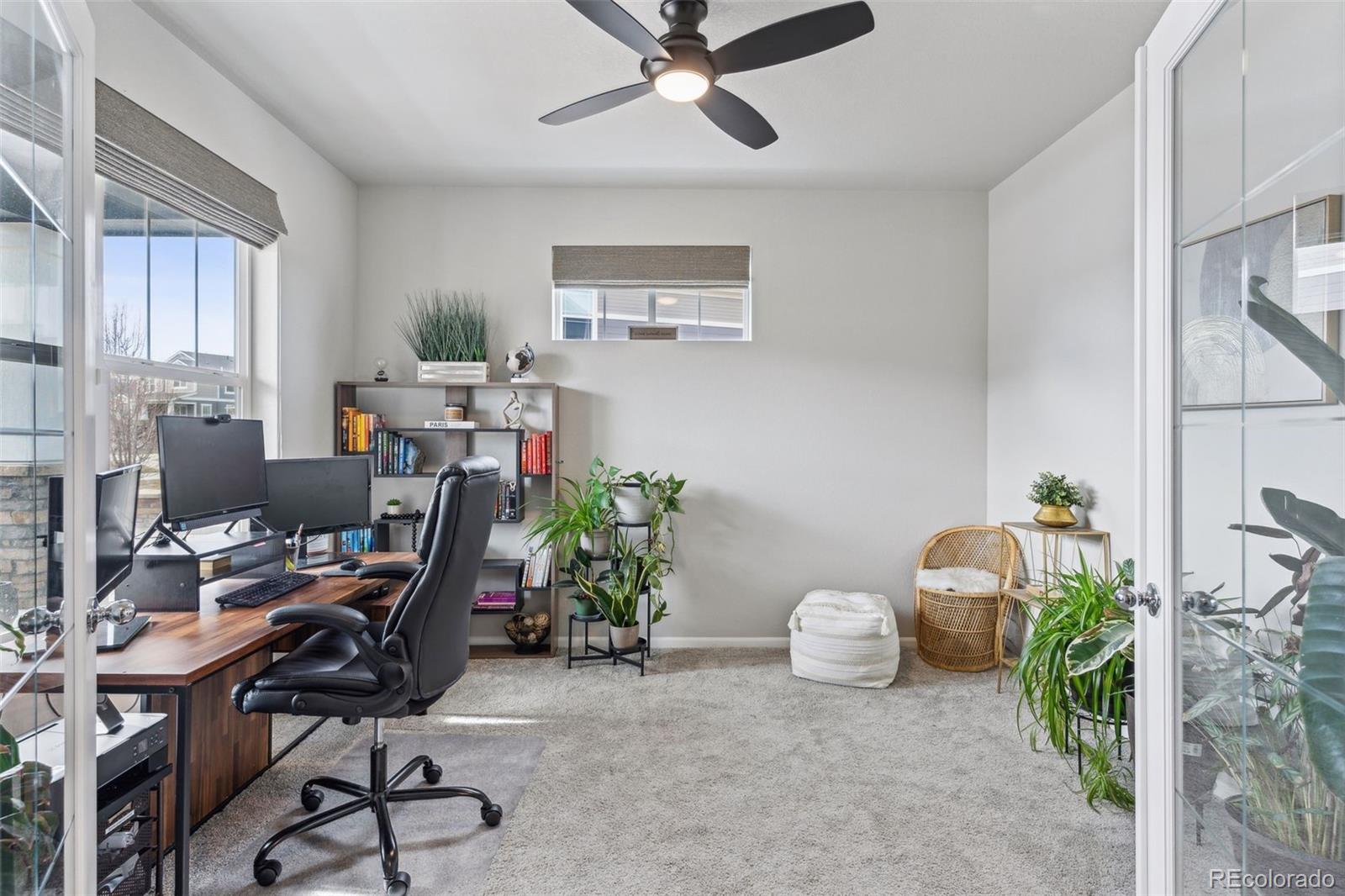 23913 East Minnow Circle Aurora, CO 80016 - Photo 8 of 49 a workspace with furniture and a window
