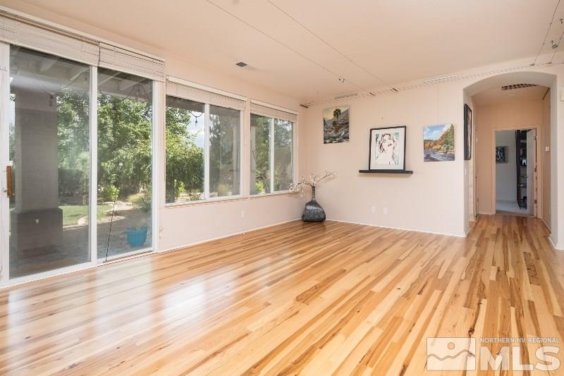 1665 Aspen Creek Road Reno, NV 89519 - Photo 11 of 25 a view of empty room with wooden floor and fan