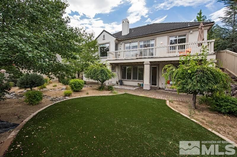 1665 Aspen Creek Road Reno, NV 89519 - Photo 21 of 25 a front view of a house with garden and porch