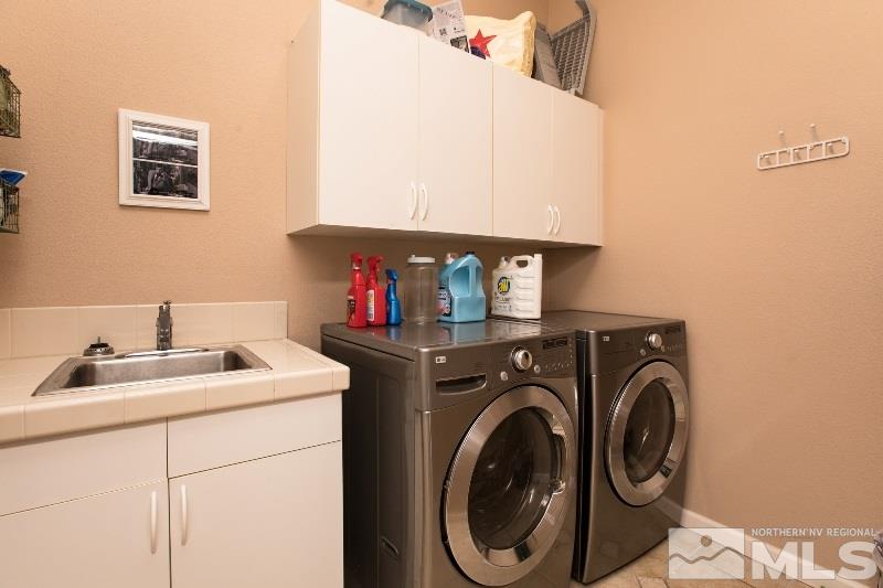1665 Aspen Creek Road Reno, NV 89519 - Photo 24 of 25 a utility room with dryer and washer