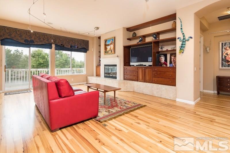 1665 Aspen Creek Road Reno, NV 89519 - Photo 3 of 25 a living room with furniture and a flat screen tv