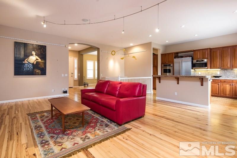 1665 Aspen Creek Road Reno, NV 89519 - Photo 6 of 25 a living room with furniture and a open kitchen view
