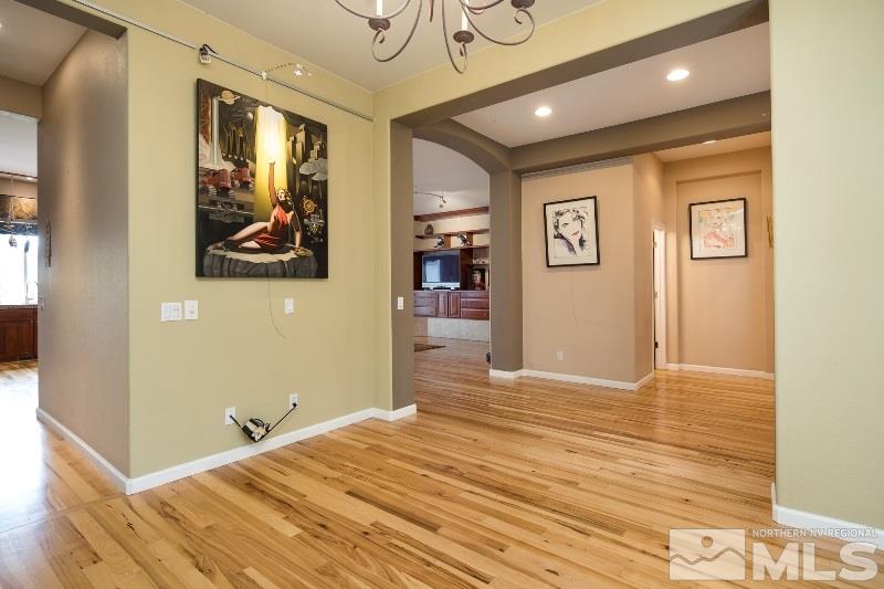 1665 Aspen Creek Road Reno, NV 89519 - Photo 8 of 25 a bedroom with a bed and painting on the wall