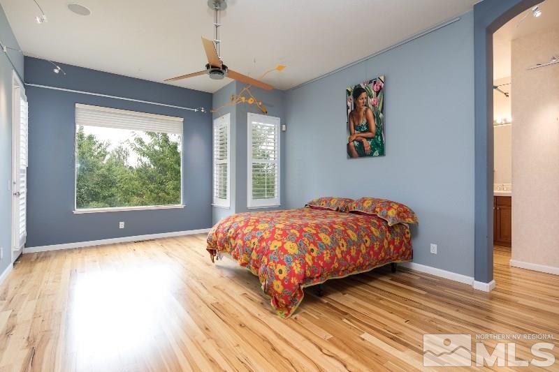 1665 Aspen Creek Road Reno, NV 89519 - Photo 9 of 25 a bedroom with a large bed and a window