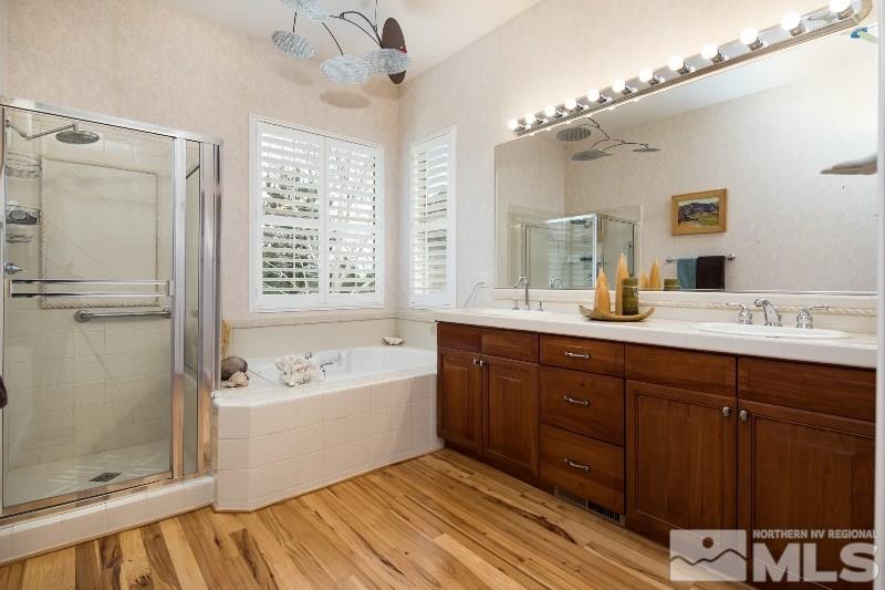 1665 Aspen Creek Road Reno, NV 89519 - Photo 10 of 25 a spacious bathroom with a tub sink shower and mirror