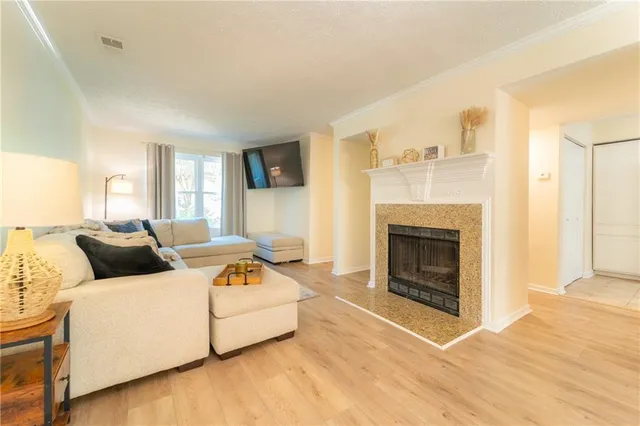 a living room with furniture and a fireplace