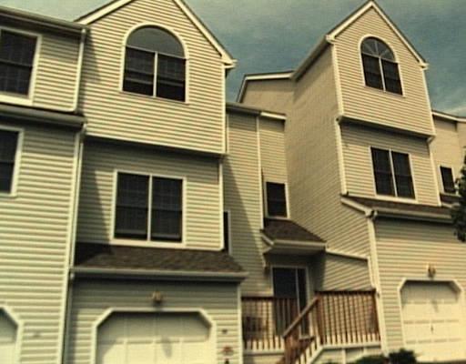 155 Rivendell Drive, Unit 155 Shelton, CT 06484 - Photo 1 of 1 a view of a house with large windows