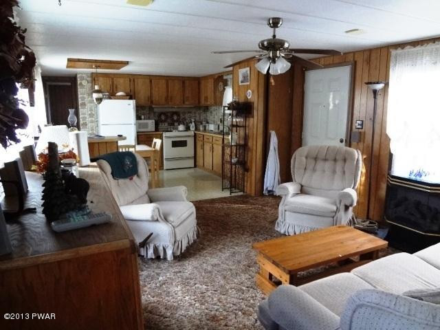 69 Salem Heights Rd Lake Lake Ariel, PA 18436 - Photo 7 of 18 a living room with furniture and a chandelier