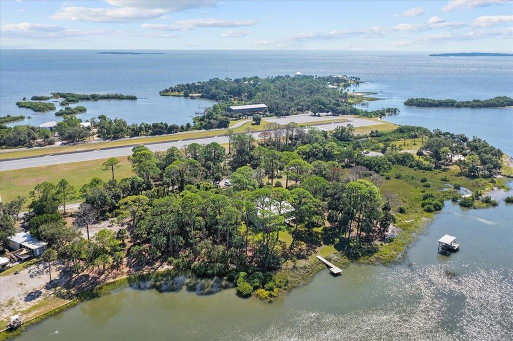 16931 Southwest 133 Street Cedar Key, FL 32625 - Photo 11 of 57 a view of a lake with a city