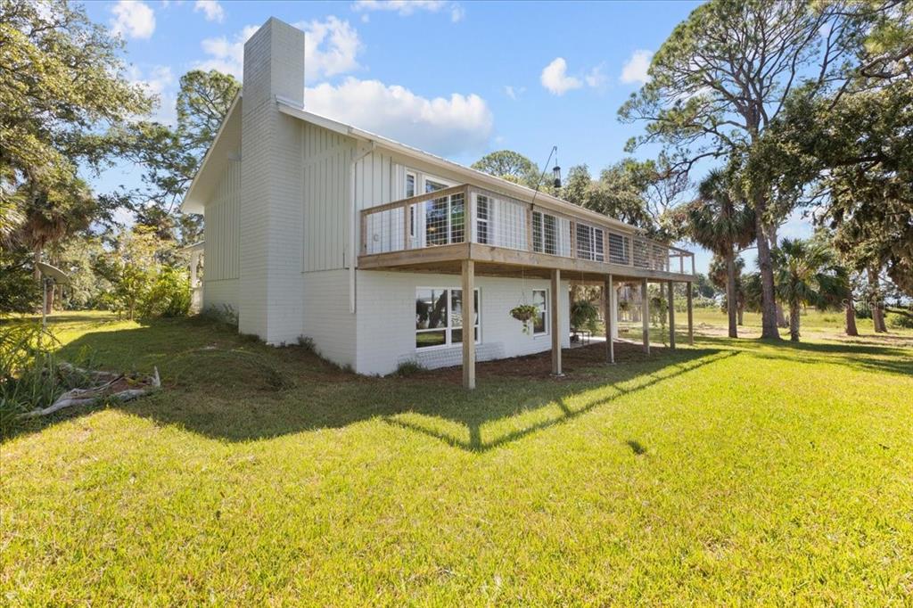 16931 Southwest 133 Street Cedar Key, FL 32625 - Photo 15 of 57 a view of a house with swimming pool