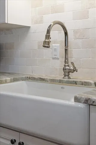 a bathroom with a double vanity sink a mirror and shower