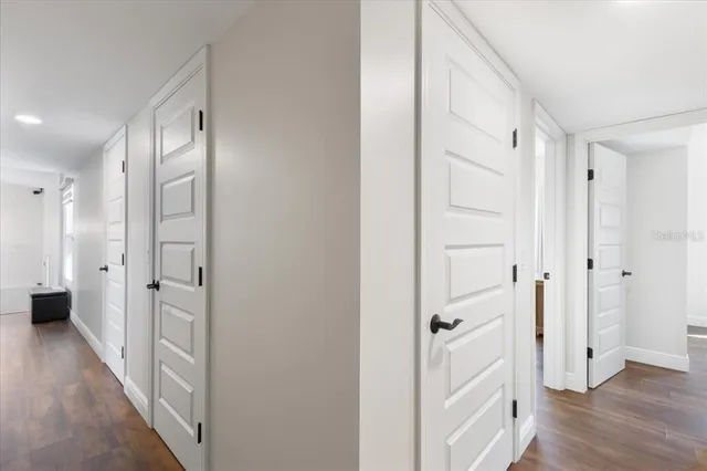 a view of balcony with wooden floor and fence