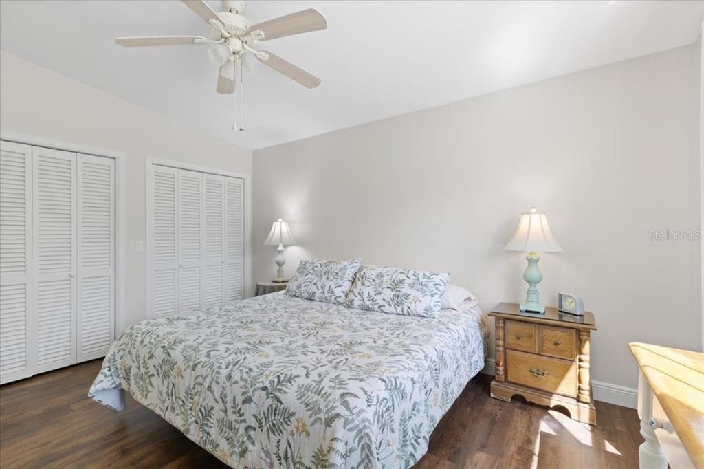 16931 Southwest 133 Street Cedar Key, FL 32625 - Photo 41 of 57 a bedroom with a bed and wooden floor