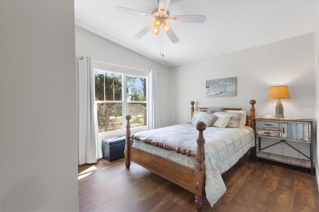 16931 Southwest 133 Street Cedar Key, FL 32625 - Photo 43 of 57 a bedroom with a bed and window