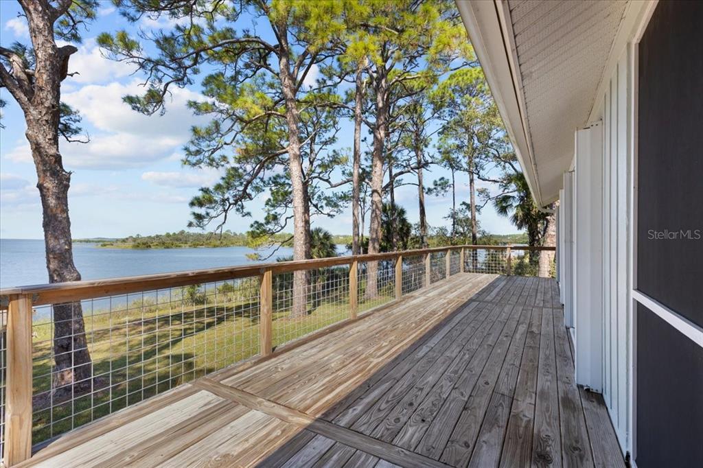 16931 Southwest 133 Street Cedar Key, FL 32625 - Photo 44 of 57 a view of balcony with wooden floor and fence