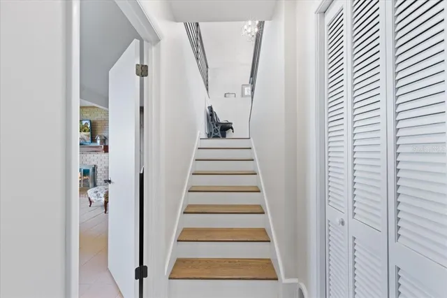 a bathroom with a toilet sink vanity and mirror
