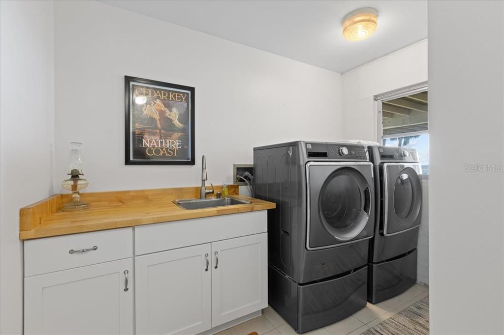 16931 Southwest 133 Street Cedar Key, FL 32625 - Photo 51 of 57 a utility room with dryer and washer