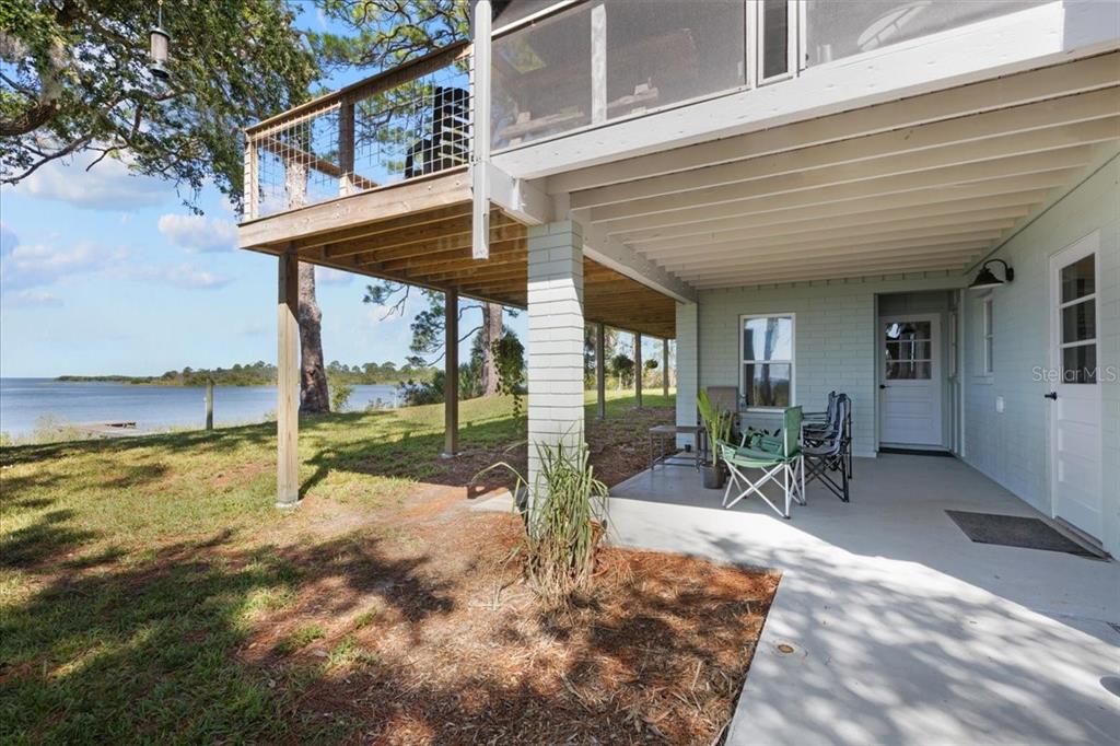 16931 Southwest 133 Street Cedar Key, FL 32625 - Photo 55 of 57 a view of a house with backyard and sitting area