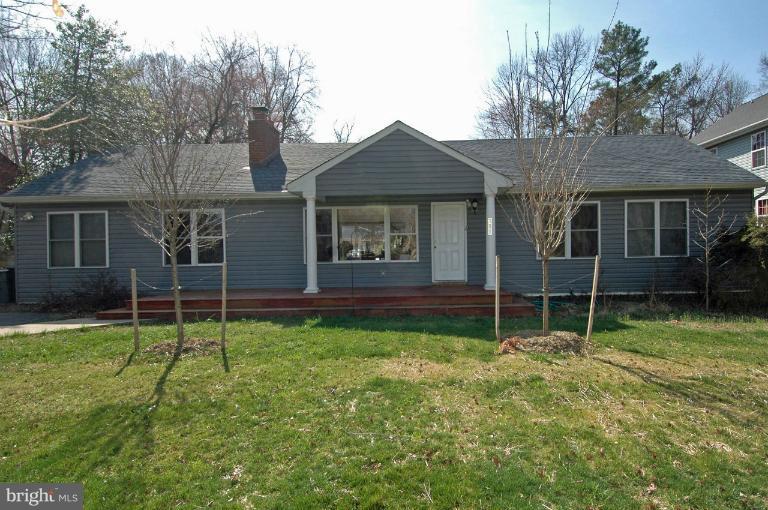 108 Farmington Road West Accokeek, MD 20607 - Photo 12 of 30 a house with trees in the background
