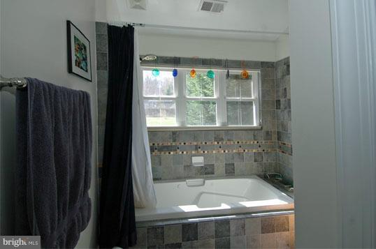 108 Farmington Road West Accokeek, MD 20607 - Photo 14 of 30 a bathroom with a bathtub