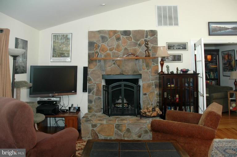 108 Farmington Road West Accokeek, MD 20607 - Photo 19 of 30 a living room with furniture and a fireplace