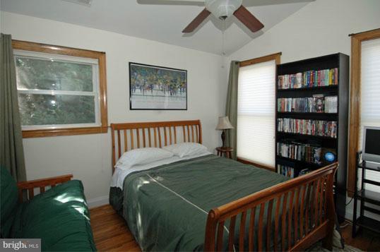 108 Farmington Road West Accokeek, MD 20607 - Photo 26 of 30 a bedroom with a bed a book shelf and a window