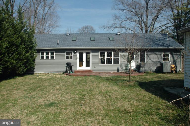 108 Farmington Road West Accokeek, MD 20607 - Photo 28 of 30 a front view of a house with garden