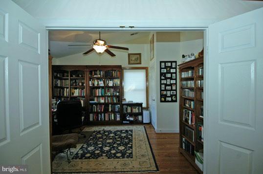 108 Farmington Road West Accokeek, MD 20607 - Photo 29 of 30 a room with wine cabinets and a fireplace