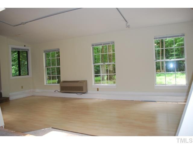 7220 Paddock Drive Raleigh, NC 27613 - Photo 6 of 10 Beautiful sunroom with skylight overlooks flat private lot.