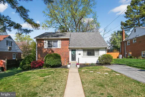 front view of a house next to a yard