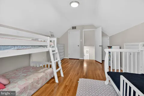 a bed room with a bed and a window