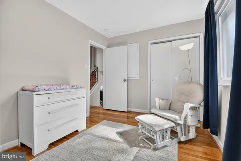 a room with a dresser and a chair
