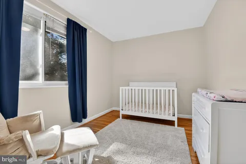 a view of a room with furniture and windows