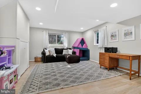a living room with furniture and a rug