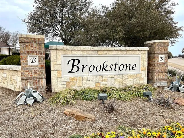 a sign broad in front of a building