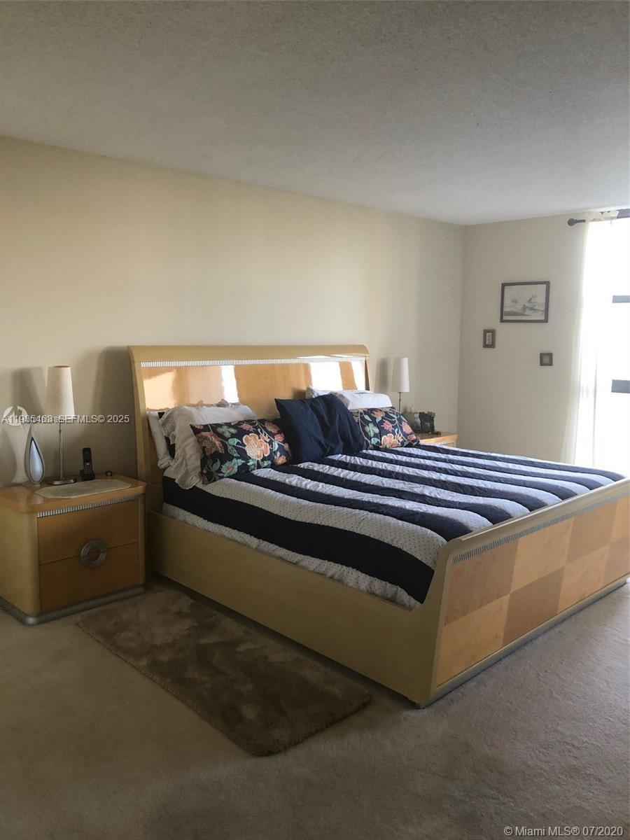 2000 Towerside Terrace, Unit 905 Miami, FL 33138 - Photo 11 of 24 a living room with furniture and a couch