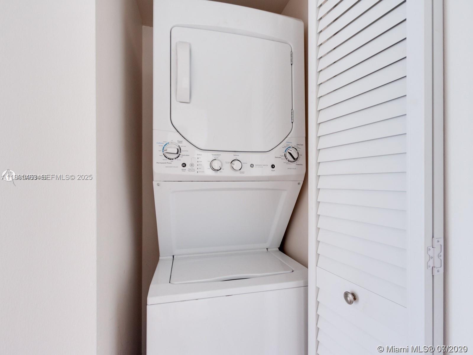 2000 Towerside Terrace, Unit 905 Miami, FL 33138 - Photo 19 of 24 a utility room with dryer and washer