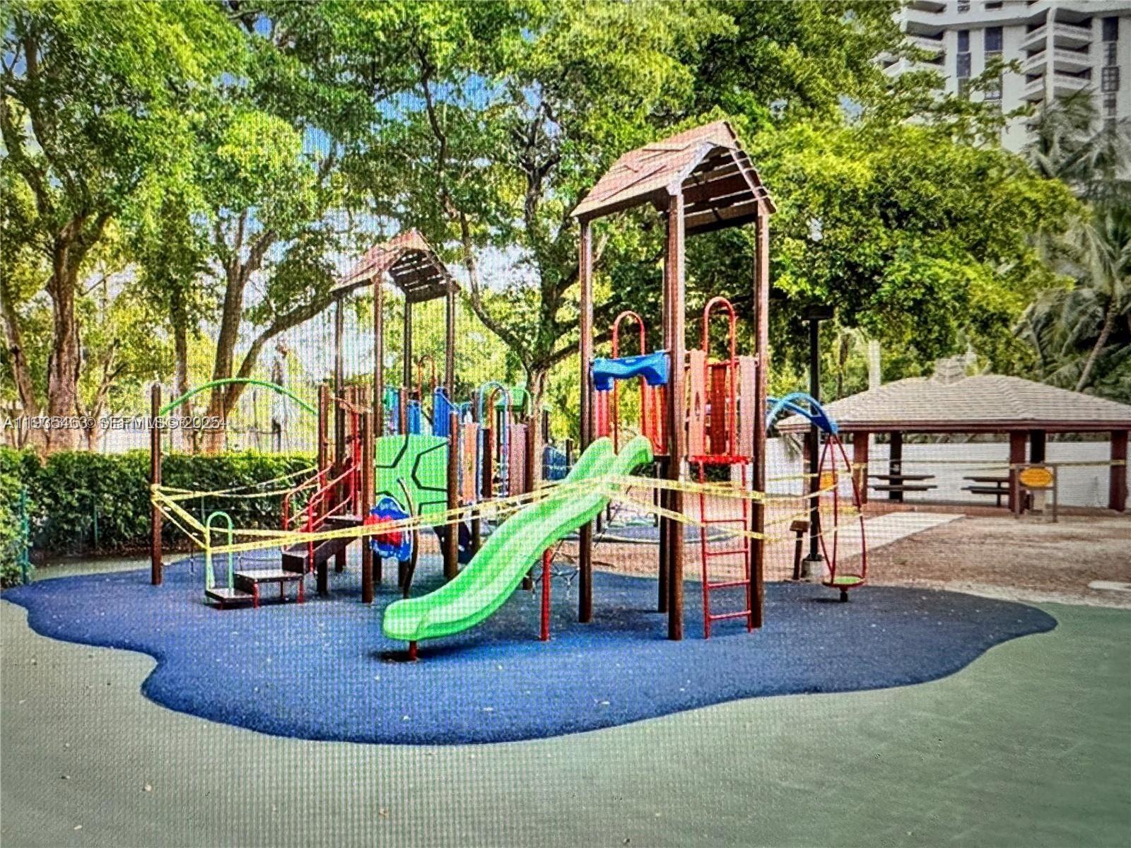 2000 Towerside Terrace, Unit 905 Miami, FL 33138 - Photo 22 of 24 a view of outdoor space with playground and green space