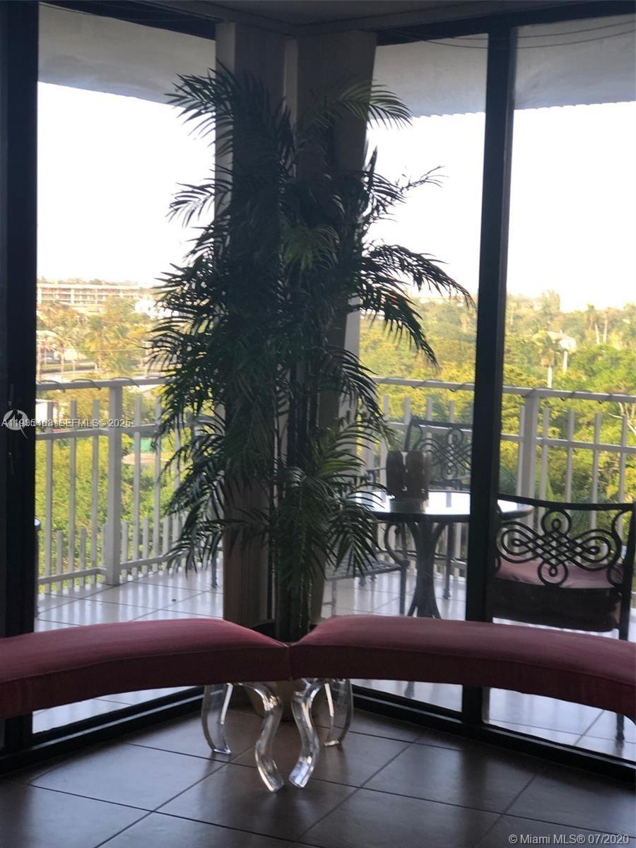 2000 Towerside Terrace, Unit 905 Miami, FL 33138 - Photo 9 of 24 a room with furniture and a window