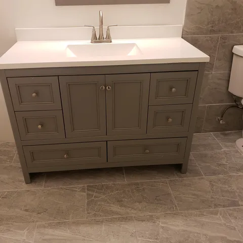 a bathroom with a sink and a vanity